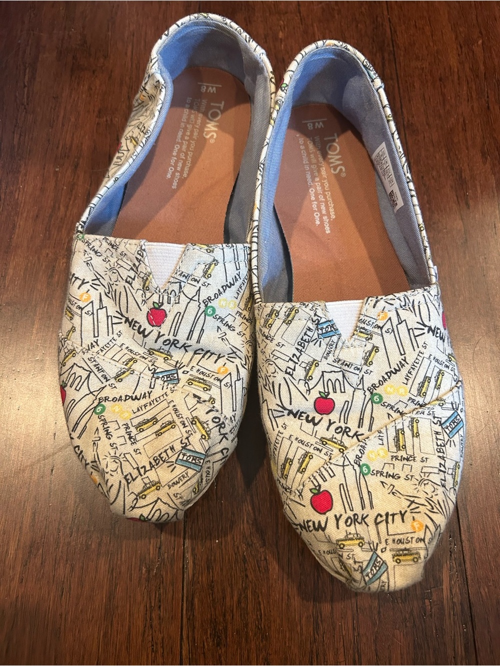 TOMS Canvas Slip-Ons with New York Map Print in Cream, Red, Yellow, Blue